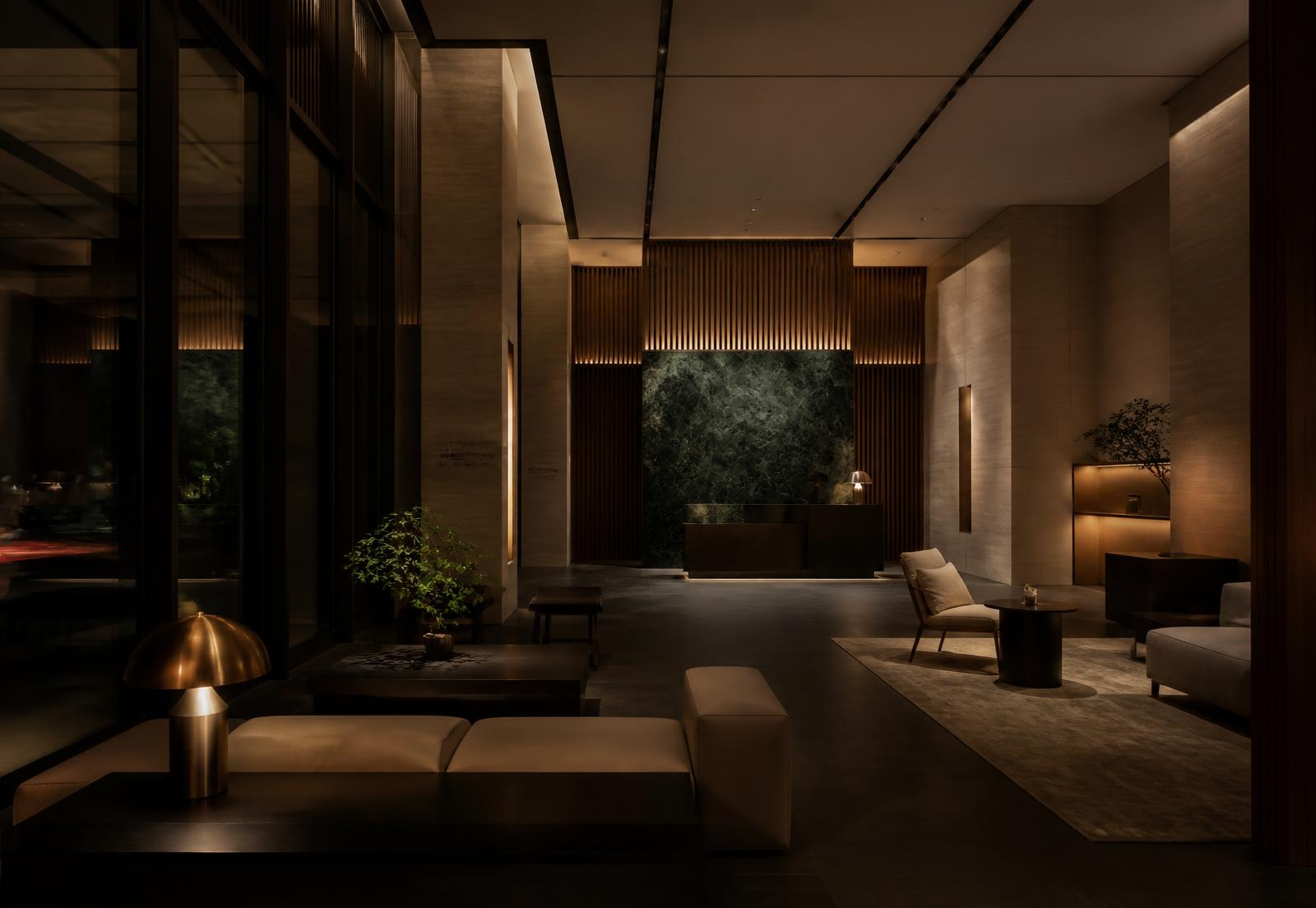 A dark, warmly lit finished hospitality interior with stone and oak detailing